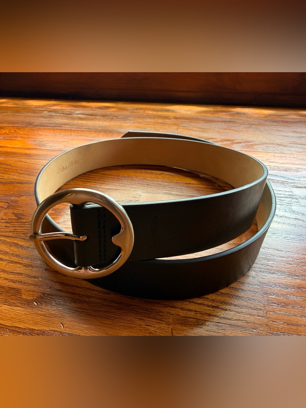 Calvin Klein Black Leather Belt with Rounded Silver Buckle